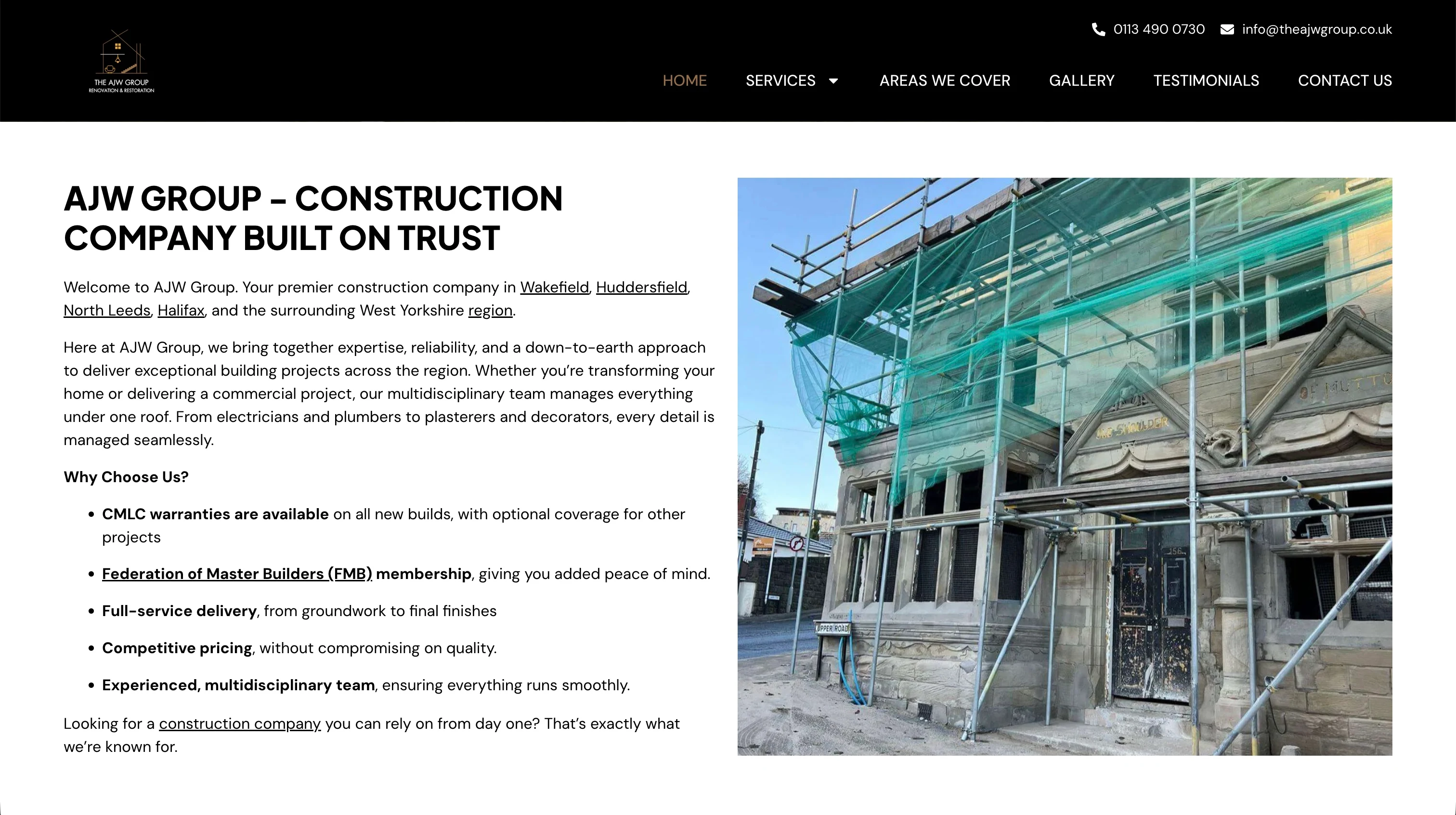 The old AJW Group website: a plain black header, all-caps headline and a long block of text beside a scaffolding photo